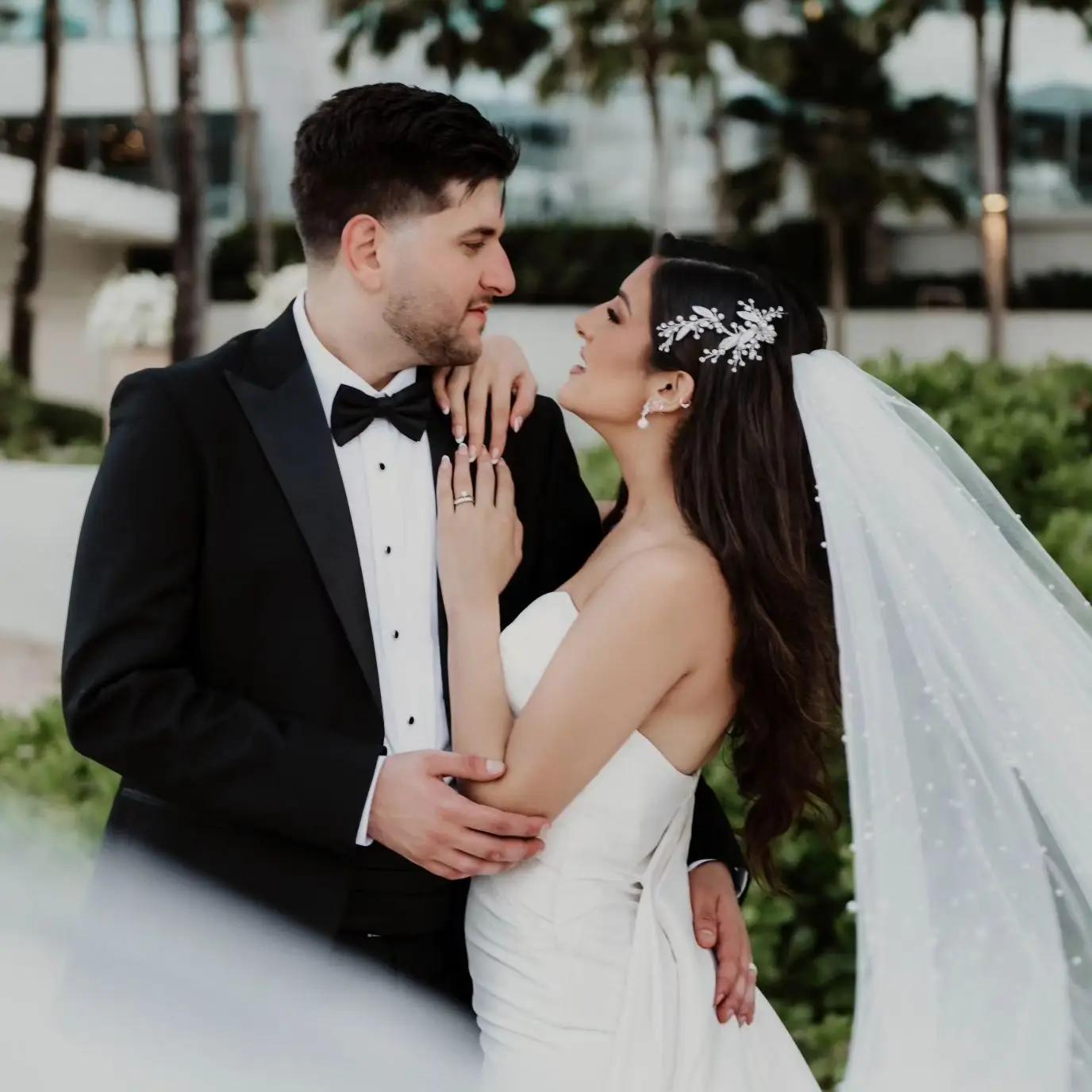 Сouple wearing a white gown and a black suit