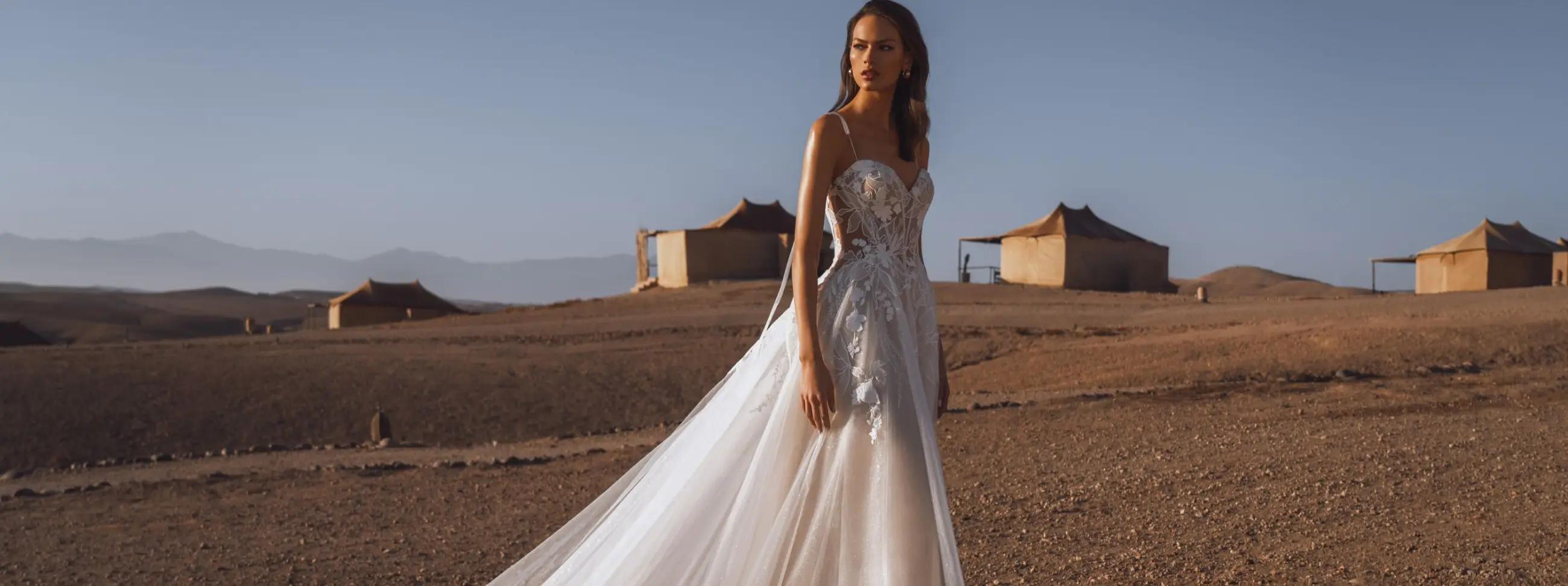 Сouple wearing a white gown and a black suit